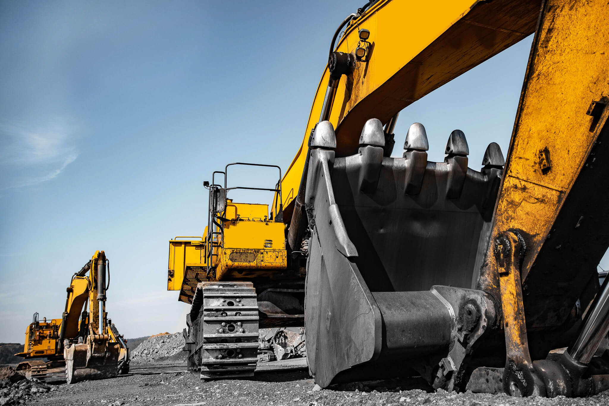 Excavator moving dirt at construction site